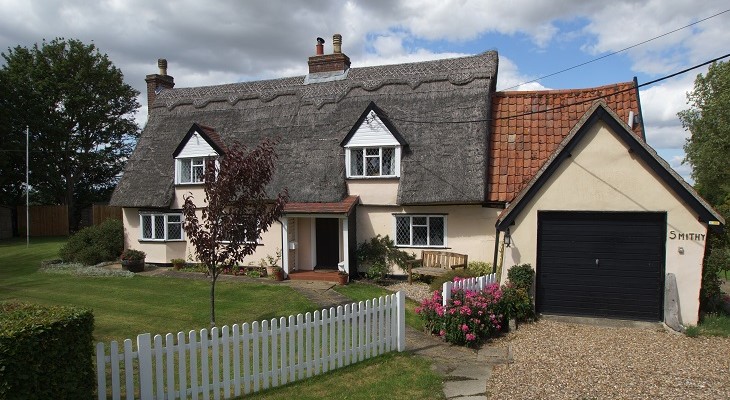 grade_ii_lised_thatched_cottage_with_white_fence_a