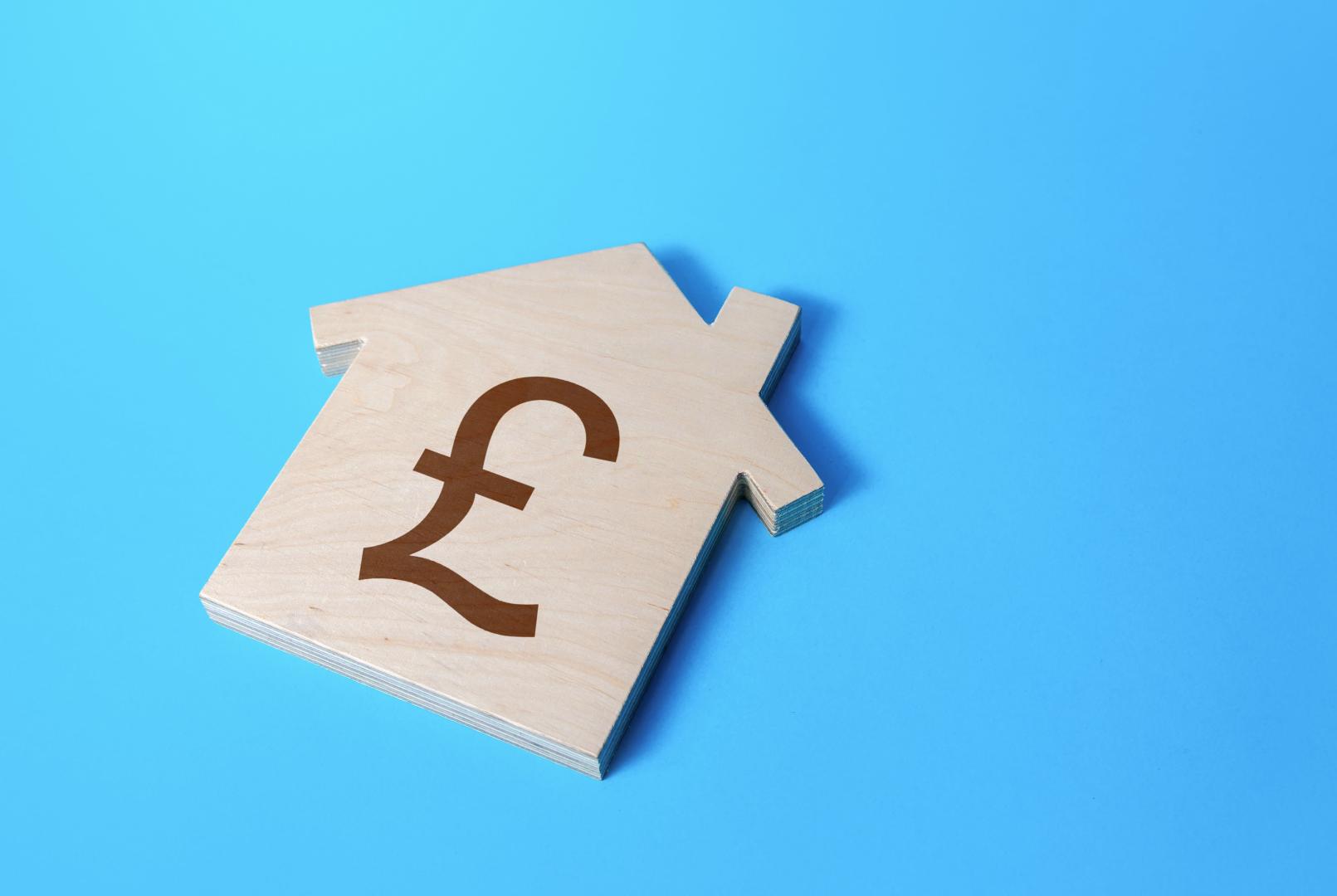 Wooden house with pound sign, on a blue background