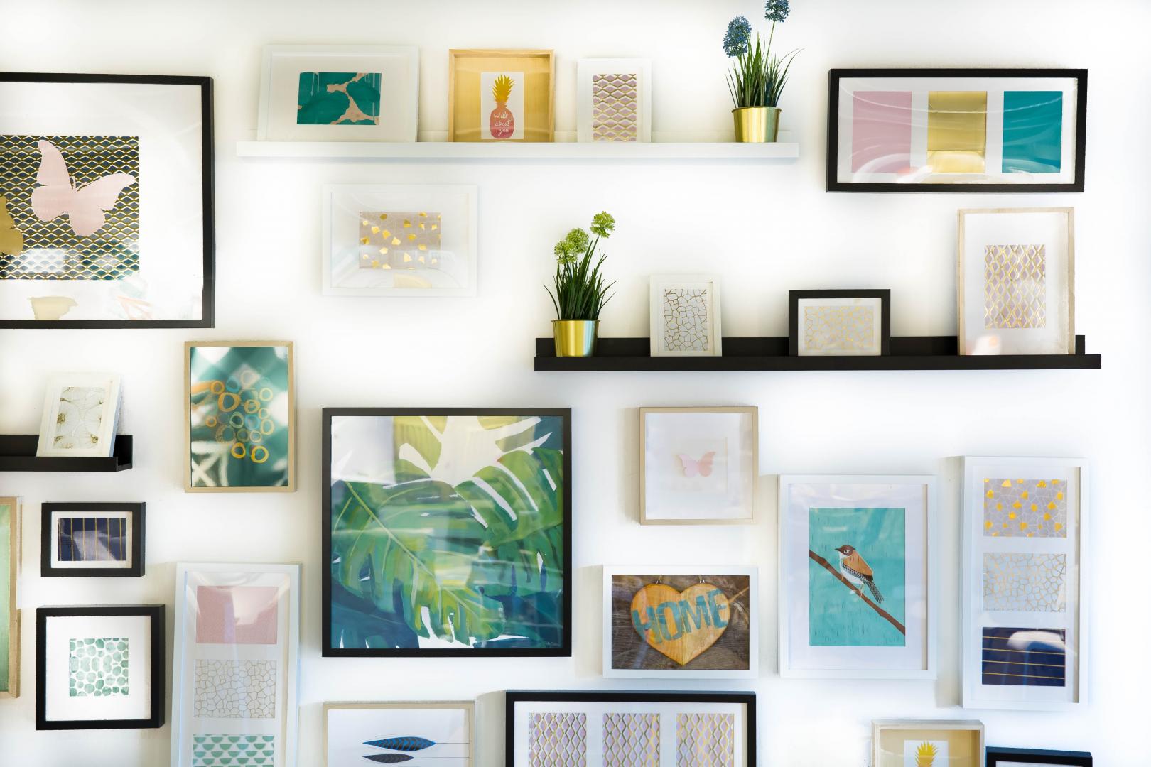 Photo of lots of frames on a white wall