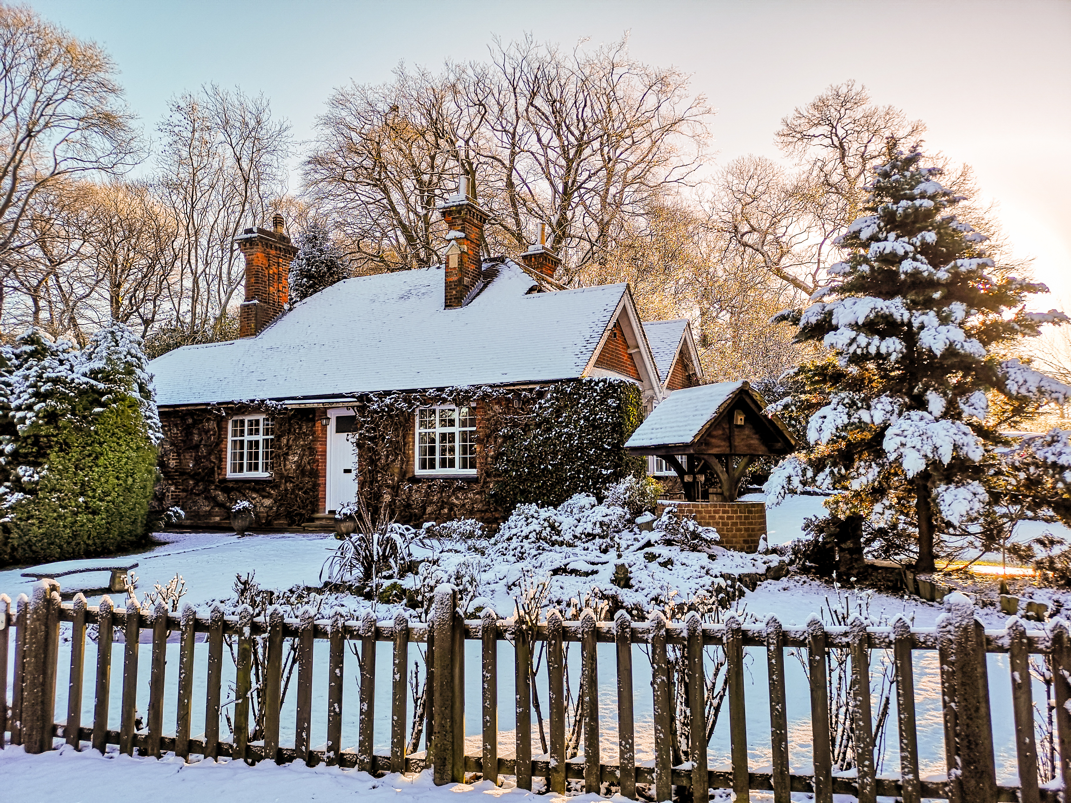 Winter snow covered village cottage in England