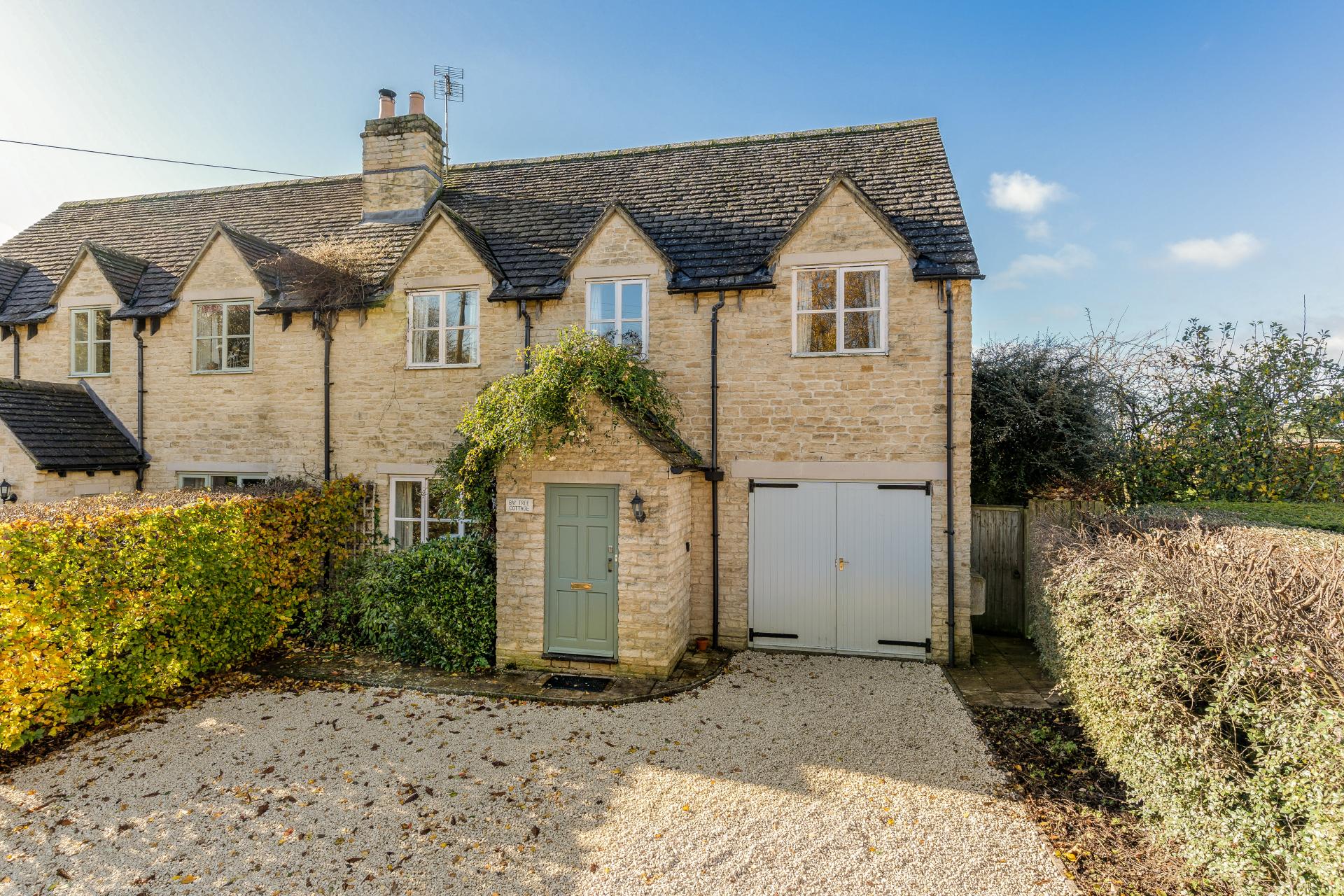 gloucestershire costwolds stone house with sage green door