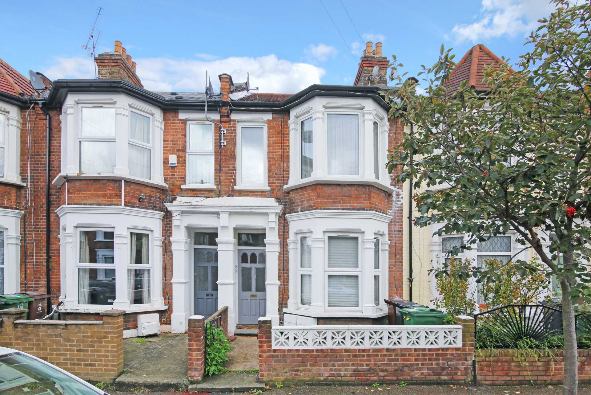 beautiful London flat in terraced house with white frame bay windows