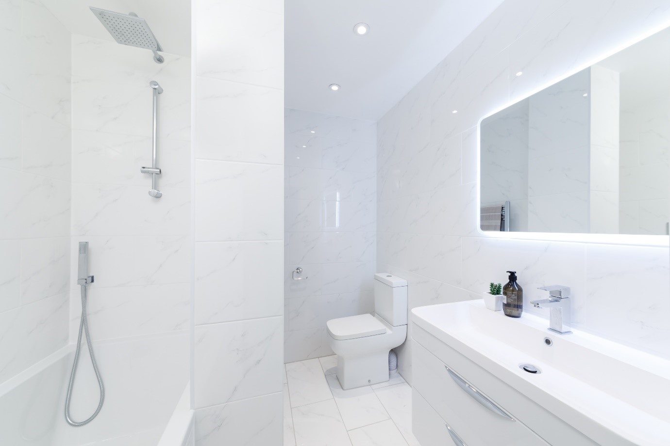 white carrara marble tile modern bright bathroom